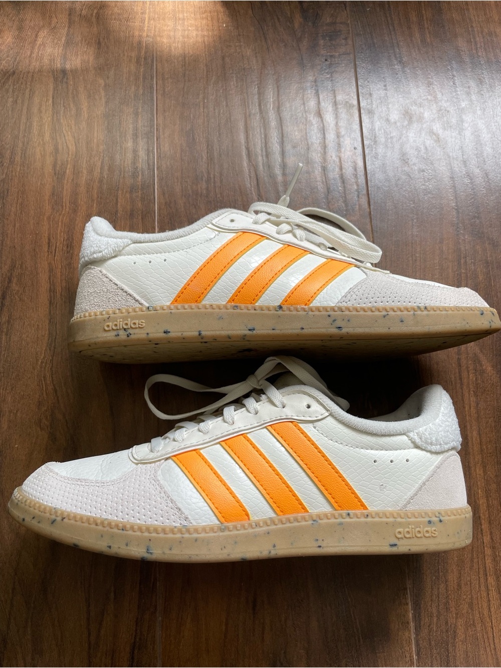 Adidas White Sneakers with Bright Orange Stripes